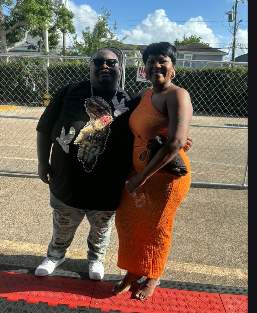 Sierra Green standing outdoors with a fellow performer at Jazz Fest